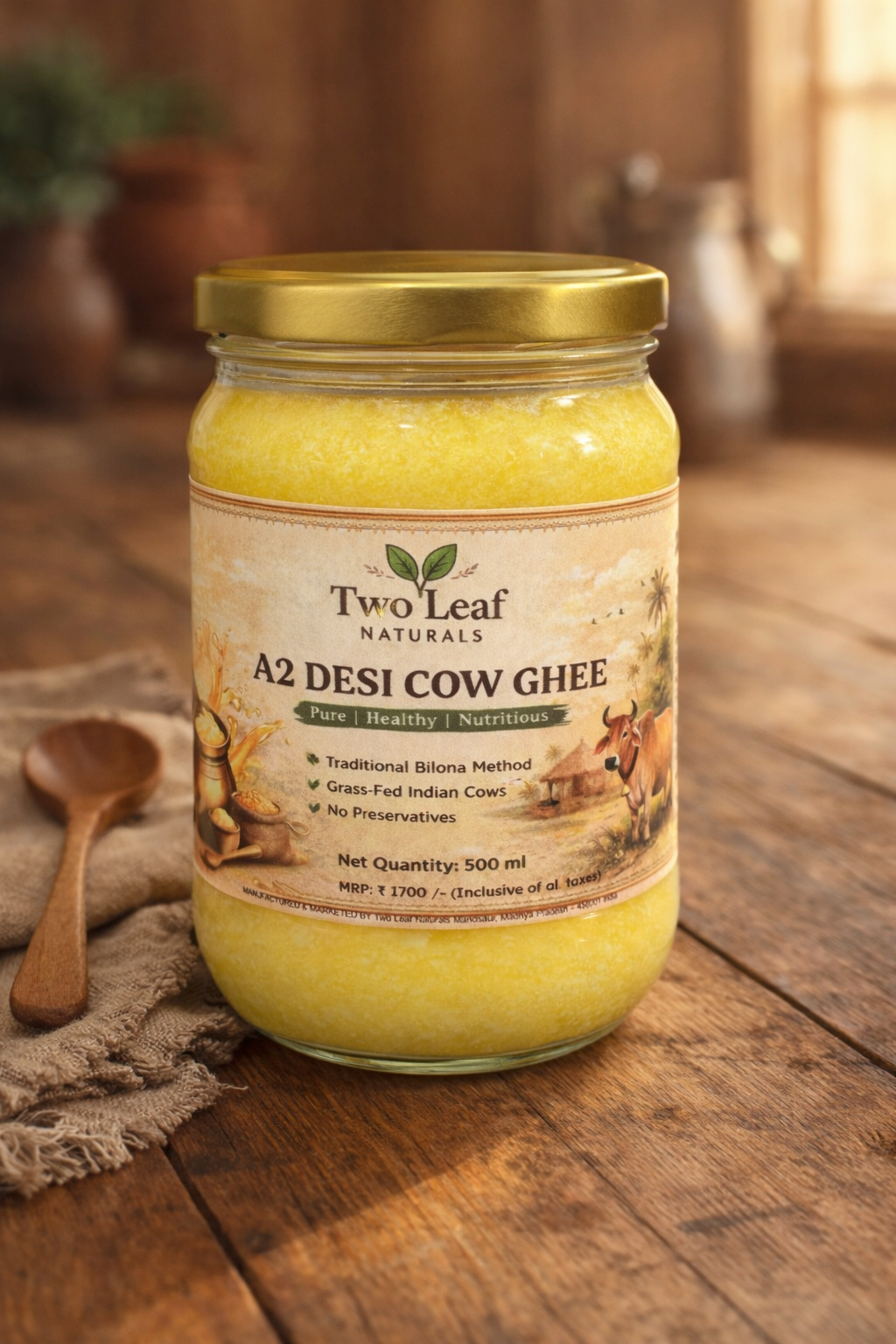 Jar of Two Leaf Naturals A2 Desi Cow Ghee on a wooden surface